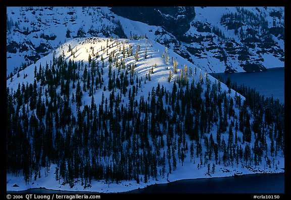 Last rays of sun on Wizard Island. Crater Lake National Park (color)