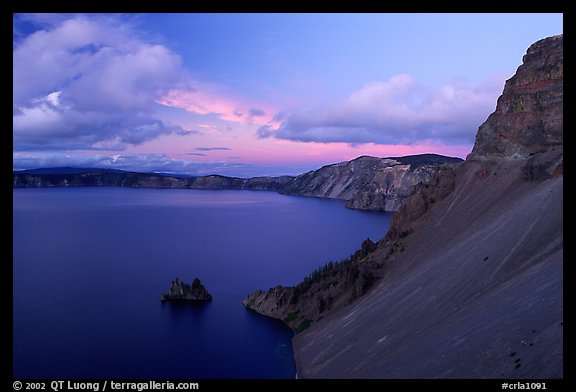 Phantom ship and lake seen from Sun Notch, sunset. Crater Lake National Park, Oregon, USA.