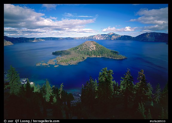 Wide view of lake with Wizard Island, afternoon. Crater Lake National Park, Oregon, USA.