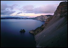 Caldera slopes and Phantom ship at dusk. Crater Lake National Park, Oregon, USA. (color)