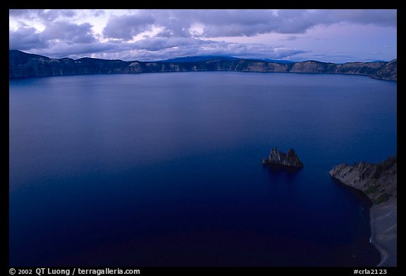 Phantom ship and lake seen from Sun Notch, dusk. Crater Lake National Park, Oregon, USA.