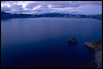 Phantom ship and lake seen from Sun Notch, dusk. Crater Lake National Park, Oregon, USA.