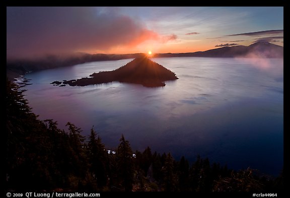 Wide view with sunrise and clouds. Crater Lake National Park, Oregon, USA.