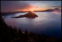 Wide view with sunrise and clouds. Crater Lake National Park, Oregon, USA.