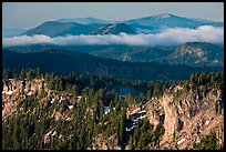 Lake rim and forest, and hills. Crater Lake National Park, Oregon, USA.