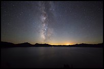 Milky Way and Crater Lake with setting moon. Crater Lake National Park, Oregon, USA.