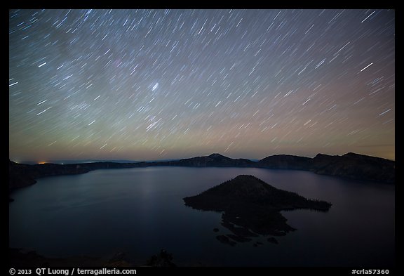 Star trails over Crater Lake and Wizard Island. Crater Lake National Park, Oregon, USA.