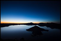 Wide view of lake with dawn on eastern horizon. Crater Lake National Park ( color)