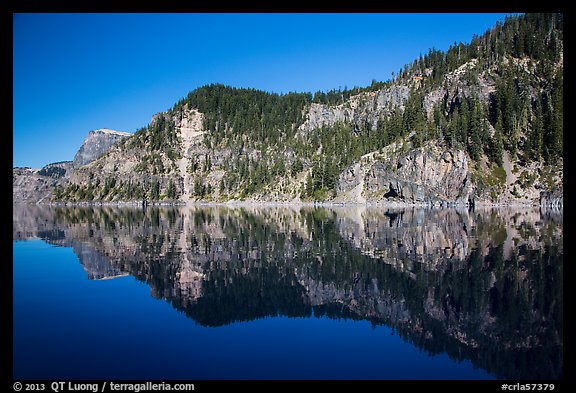 Cliffs reflected in calm waters. Crater Lake National Park (color)