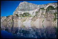 Llao Rock reflected in rippled water. Crater Lake National Park ( color)
