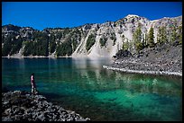 Visitor looking, Fumarole Bay, Wizard Island. Crater Lake National Park, Oregon, USA.