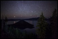 Trees, Wizard Island and lake at night. Crater Lake National Park, Oregon, USA.