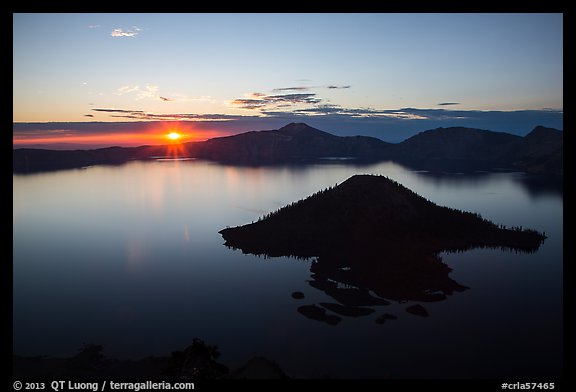 Sun rising below cloud band. Crater Lake National Park (color)