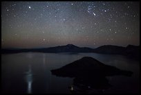 Stars and reflections over lake. Crater Lake National Park, Oregon, USA.