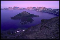 Wizard Island and crater at sunset. Crater Lake National Park, Oregon, USA.