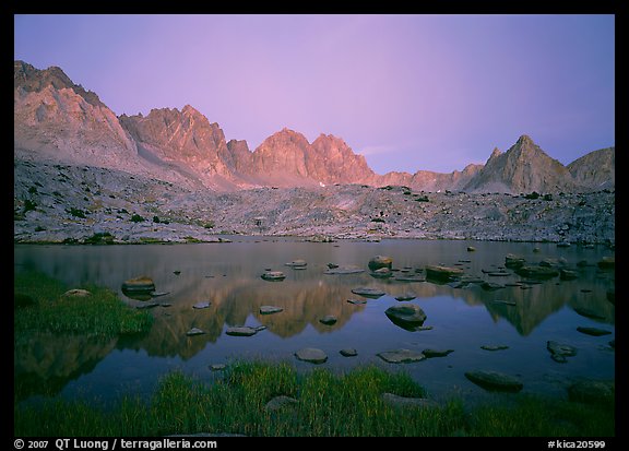 Mt Agasiz, Mt Thunderbolt, and Isoceles Peak reflected in a lake in Dusy Basin, sunset. Kings Canyon National Park, California, USA.