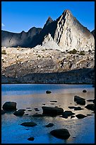 Isocele Peak reflected in lake, late afternoon, Dusy Basin. Kings Canyon National Park, California, USA.