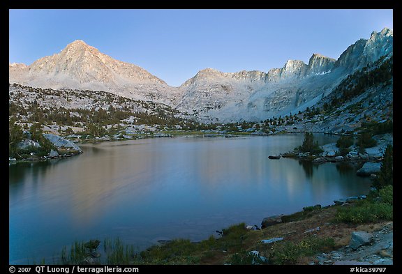 Columbine Peak, Palissades, and Mt Giraud at dusk above lake. Kings Canyon National Park, California, USA.