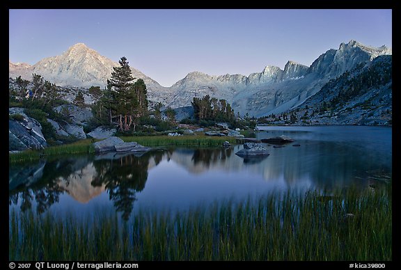 Lake, grasses, and Palissade mountains at dusk. Kings Canyon National Park, California, USA.