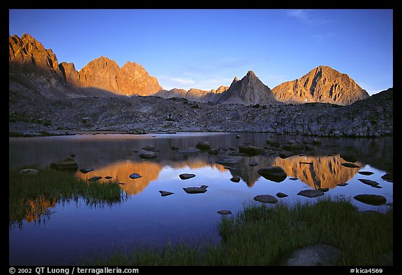 Mt Thunderbolt, Isoceles Peak, and Palissades reflected in a lake in Dusy Basin, sunset. Kings Canyon National Park, California, USA.