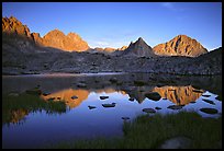 Mt Thunderbolt, Isoceles Peak, and Palissades reflected in a lake in Dusy Basin, sunset. Kings Canyon National Park, California, USA. (color)