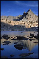 Isoceles Peak reflected in a lake in Dusy Basin, late afternoon. Kings Canyon National Park, California, USA.