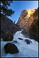 Roaring River Falls below high granite cliff. Kings Canyon National Park, California, USA.