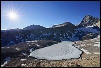 Sun and frozen lake from Forester Pass. Kings Canyon National Park ( color)