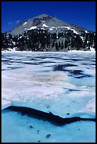 Ice break up in lake Helen and Lassen Peak, early summer. Lassen Volcanic National Park, California, USA.