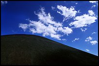 Smooth cinder cone profile and clouds. Lassen Volcanic National Park, California, USA.