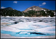 Helen Lake with Ice breaking up, and Lassen Peak. Lassen Volcanic National Park, California, USA. (color)