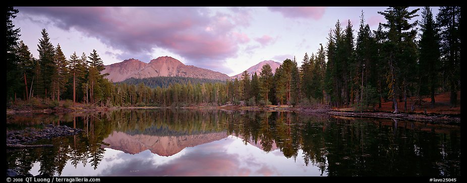 Volcanic peak and conifer reflected in lake. Lassen Volcanic National Park, California, USA.