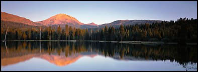 Lassen Peak reflected in Manzanita lake at sunset. Lassen Volcanic National Park, California, USA.