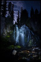 Dimly lit Kings Creek Falls and sky at night. Lassen Volcanic National Park, California, USA.