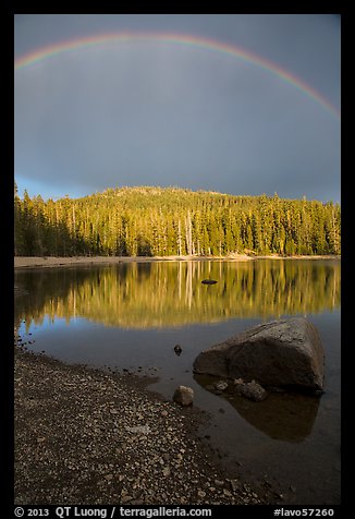 Rainbow and boulder, Juniper Lake. Lassen Volcanic National Park, California, USA.