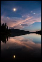 Moon and reflection at dusk, Juniper Lake. Lassen Volcanic National Park, California, USA.