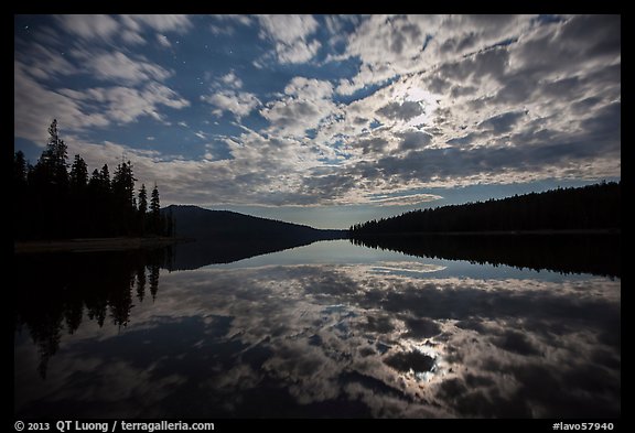 Moonlit clouds over Juniper Lake at night. Lassen Volcanic National Park, California, USA.