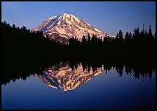 Mount Rainier with calm reflection in Eunice Lake, sunset. Mount Rainier National Park, Washington, USA.