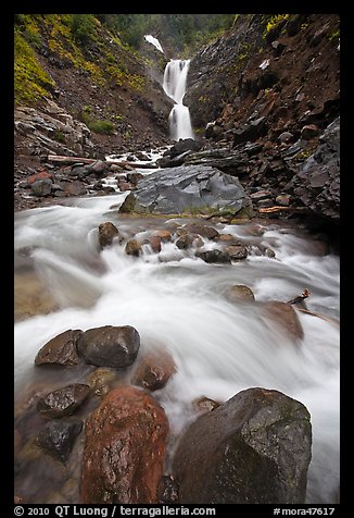 Water flowing over boulders from waterfall. Mount Rainier National Park, Washington, USA.