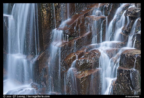 Waterfall over columns of cooled lava. Mount Rainier National Park, Washington, USA.