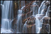 Waterfall over columns of cooled lava. Mount Rainier National Park, Washington, USA.