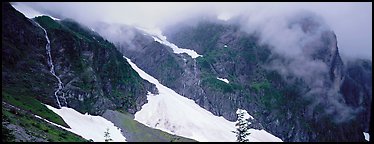Waterfalls, neves, and clouds, North Cascades National Park.  (Panoramic color)