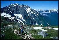 Mountaineer hiking on the way to Sahale Peak,  North Cascades National Park.  ( color)