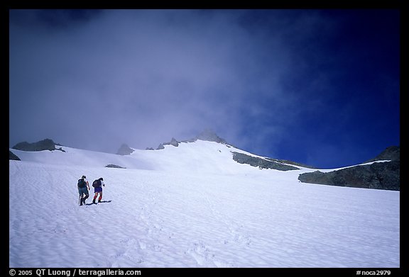 Mountaineers climbing a snow field on Sahale Peak,  North Cascades National Park.  (color)