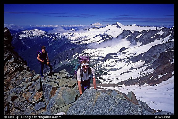 Mountaineers on ridge below  summit of Sahale Peak, North Cascades National Park. Washington, USA.