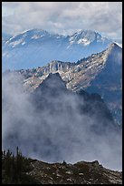 Peaks partly obscured by clouds, North Cascades National Park. Washington, USA.