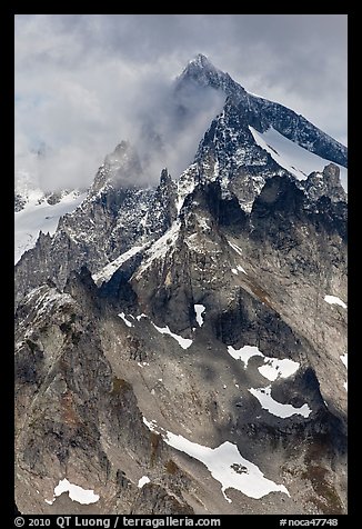 Cloud-shrouded Eldorado Peak, North Cascades National Park. Washington, USA.