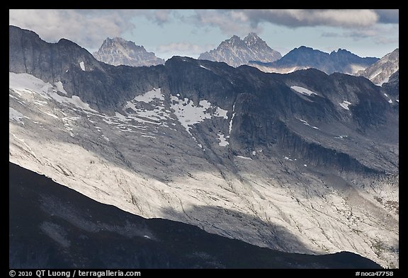 Distant peaks in dabbled afternoon light, North Cascades National Park.  (color)