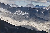 Distant peaks in dabbled afternoon light, North Cascades National Park. Washington, USA.