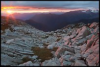 Last rays of sunset color rocks in alpine basin, North Cascades National Park. Washington, USA.